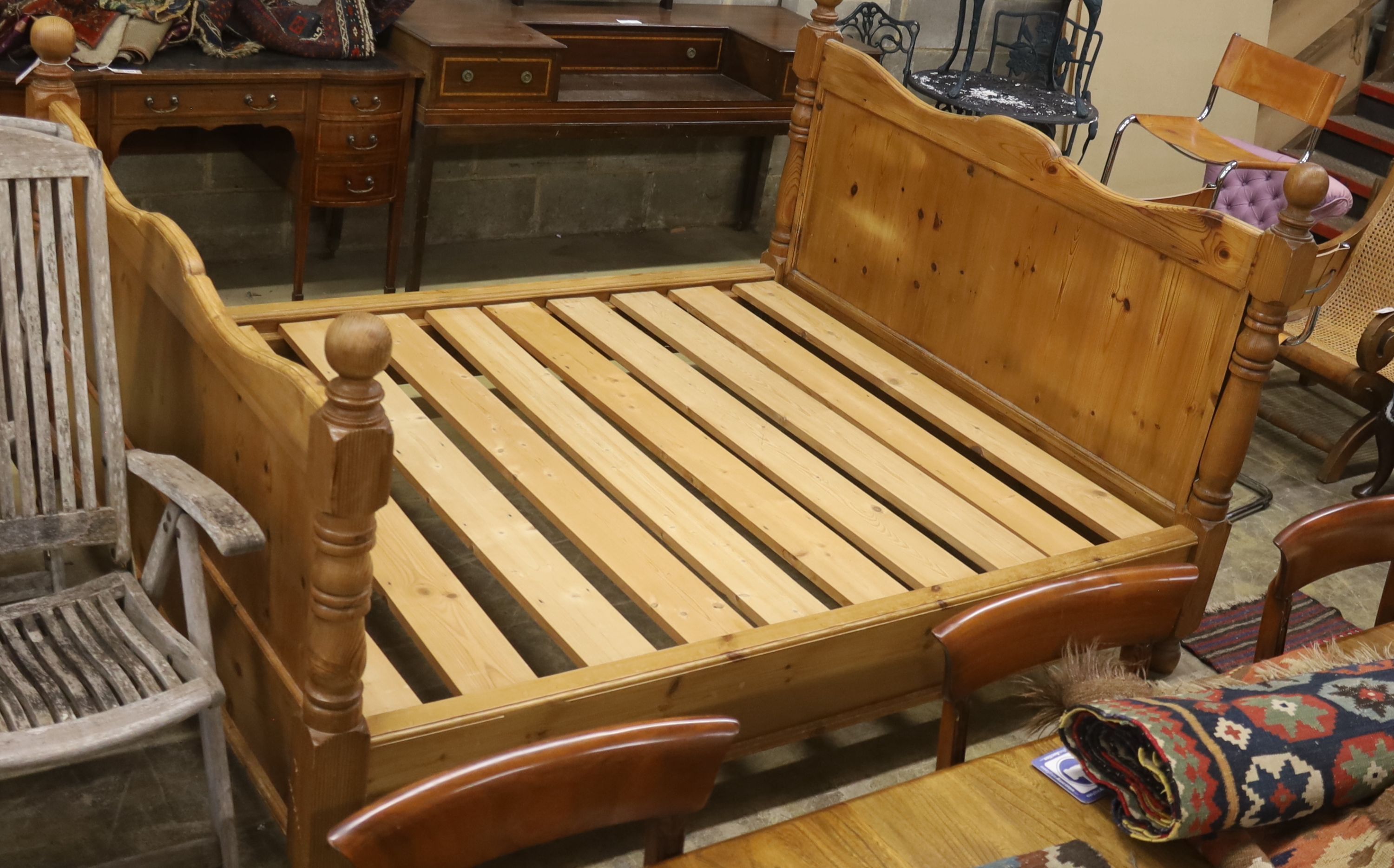 A king size pine bed frame with side rails and slats, width 170cm, length 213cm